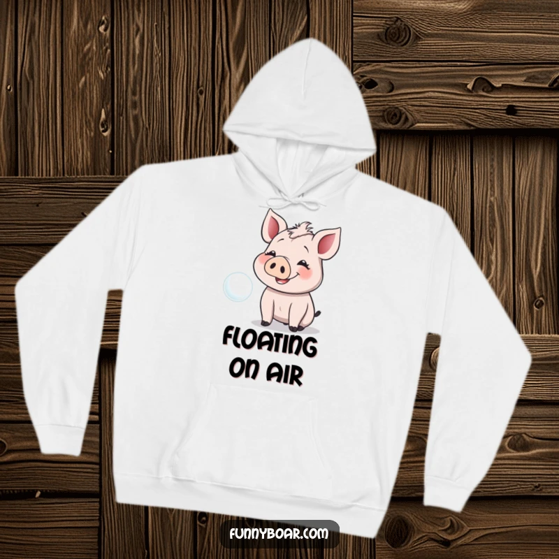 Funny Hoodie: A smiling boar with floppy ears giggles while reaching for a floating bubble, soft and comforting.